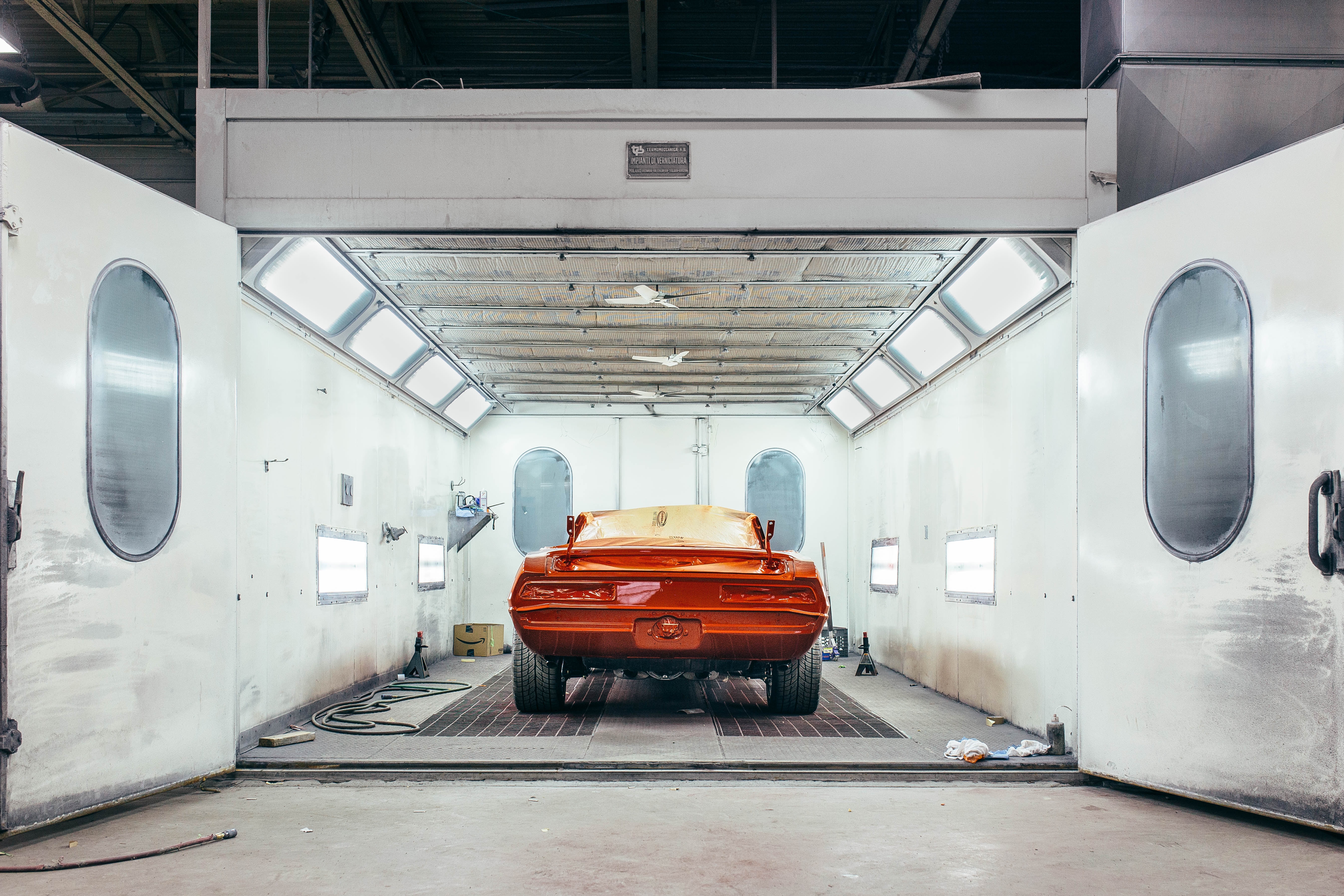 Vehicle in Paint Booth, prepped for spray painting